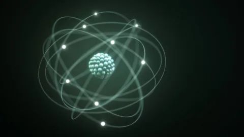 A stylized illustration of a Bohr model atom, showing a dense central nucleus with electrons orbiting around it.