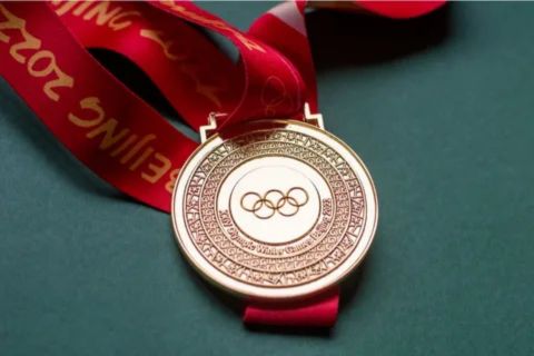 Modern Olympic gold medal (Beijing 2022) made of silver plated with 6 grams of pure gold.